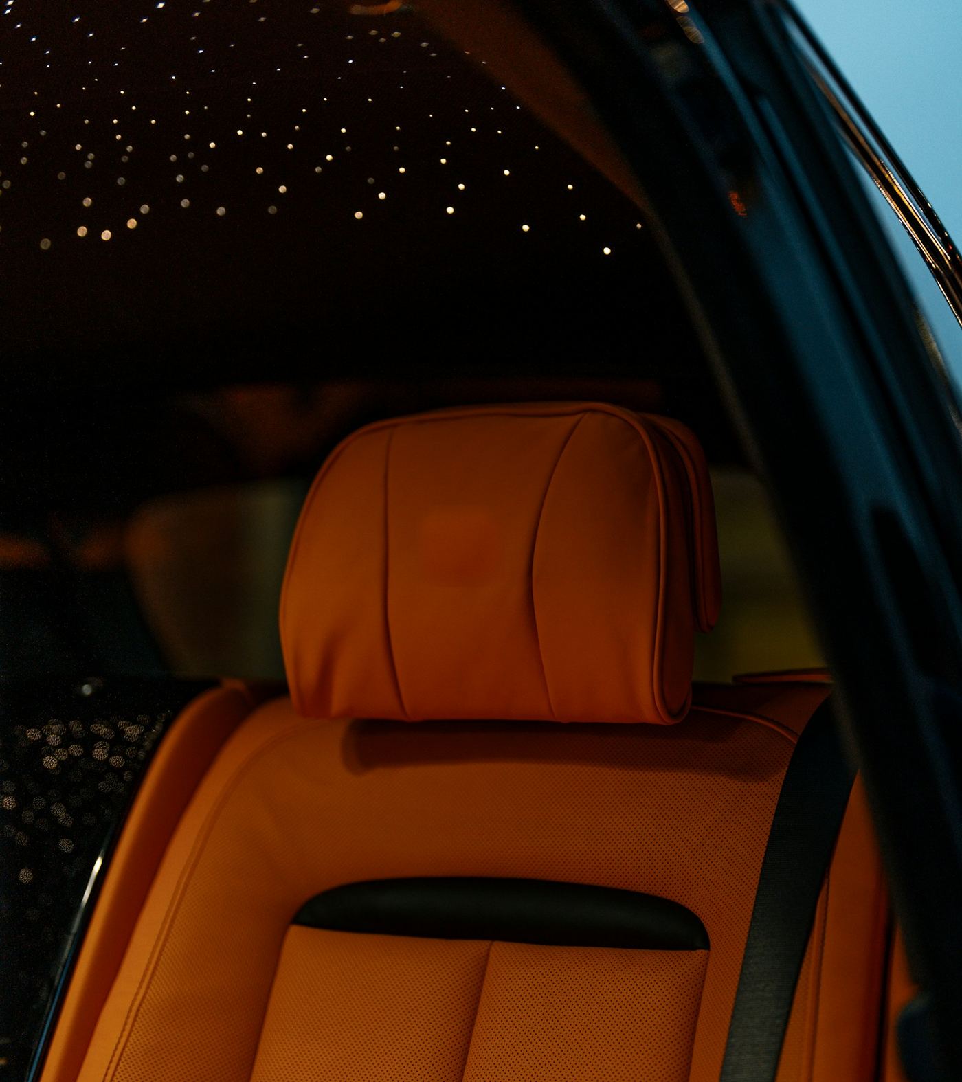 Warm starlight ceiling and tan leather cabin sample
